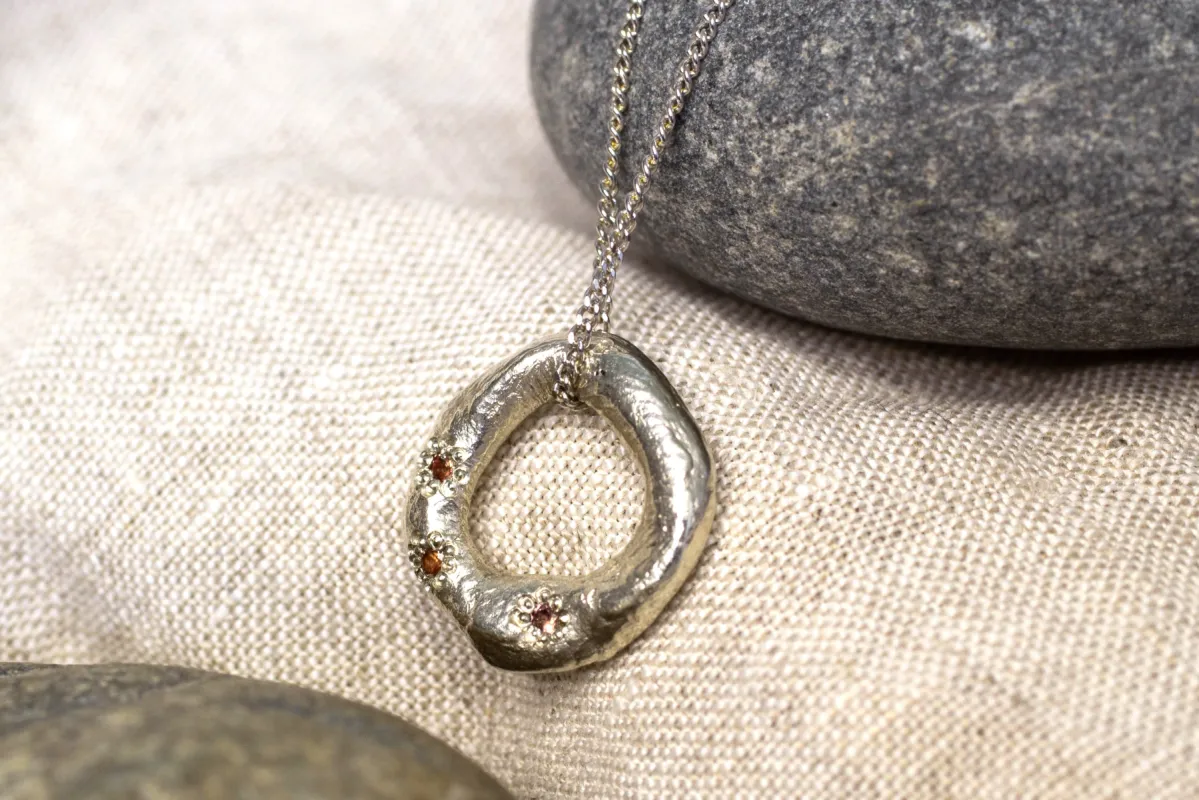 Circle Pendant - White Gold with Padparadscha Sapphires sold by Sophie Divett Jewelry