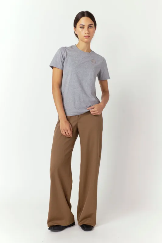 Huddle badge t-shirt sold by Kate Sylvester