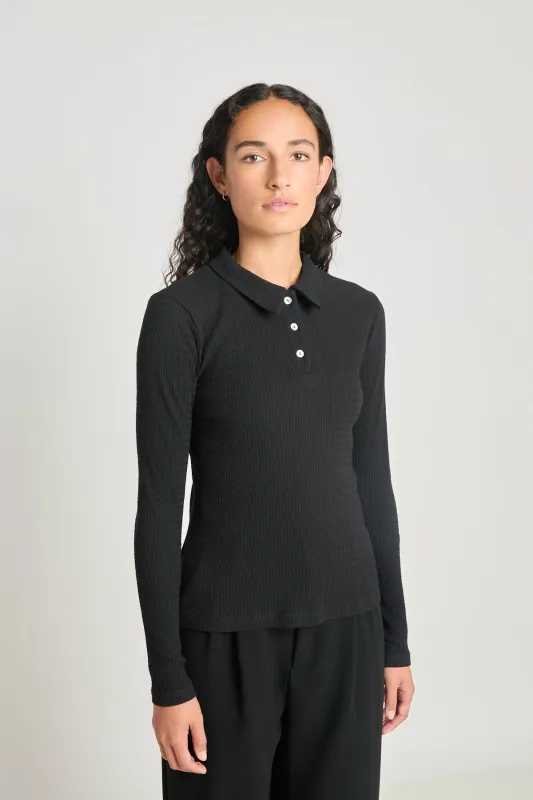 Unconditional polo sold by Twenty-Seven Names