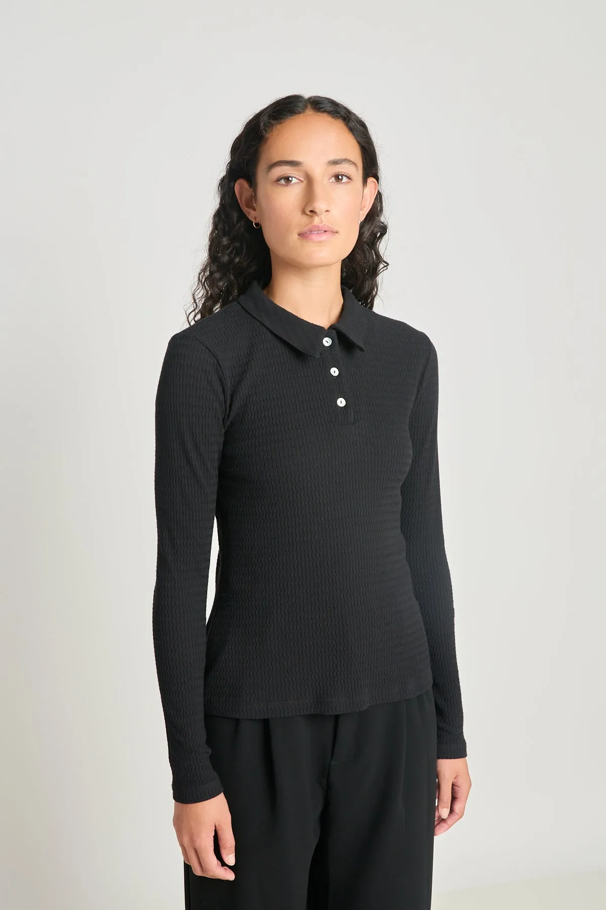 Unconditional polo sold by Twenty-Seven Names