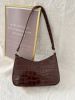 croc embossed baguette bag sold by SHEIN
