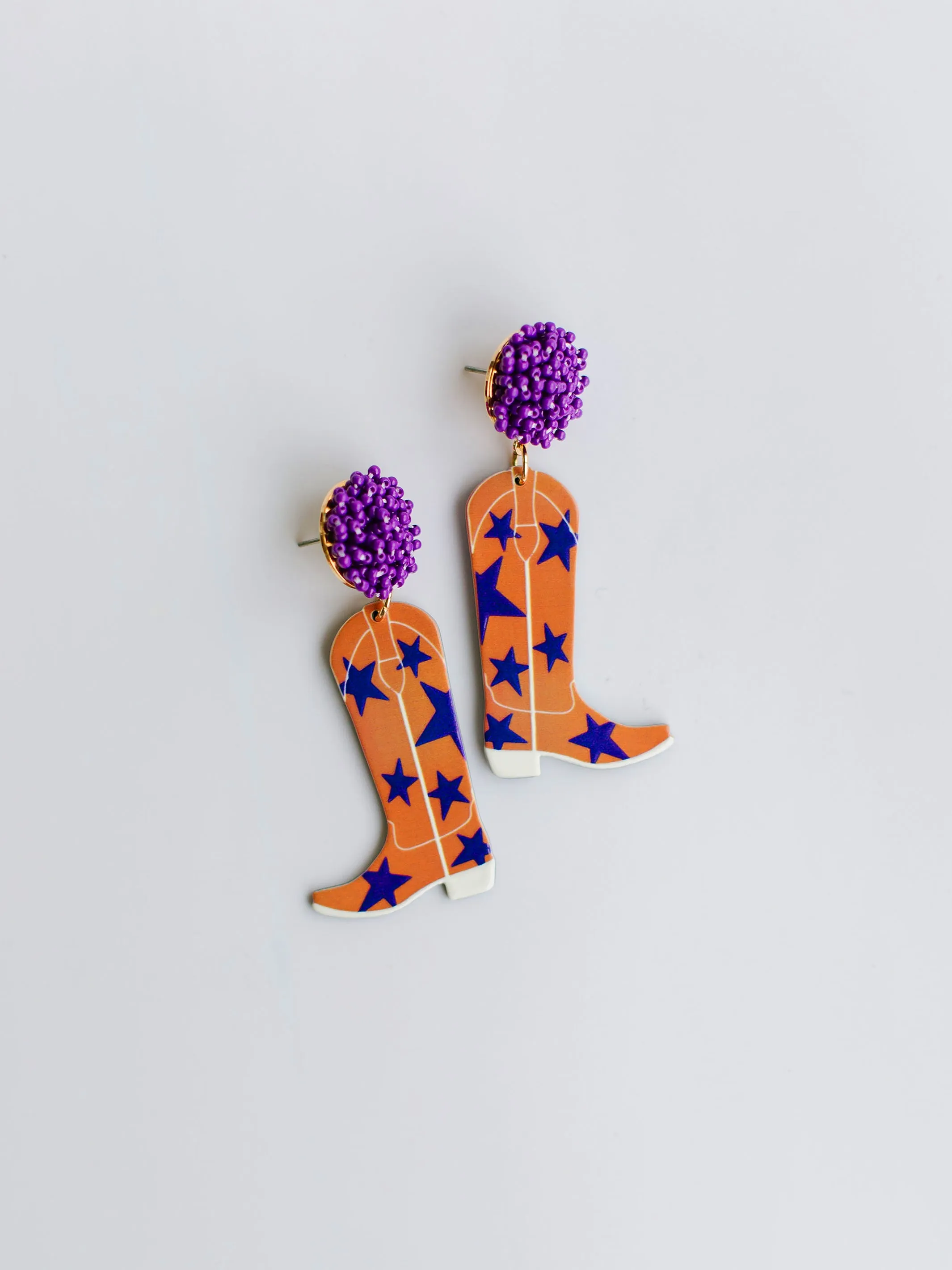 Gameday Cowgirl Earrings | Purple + Orange sold by Michelle McDowell
