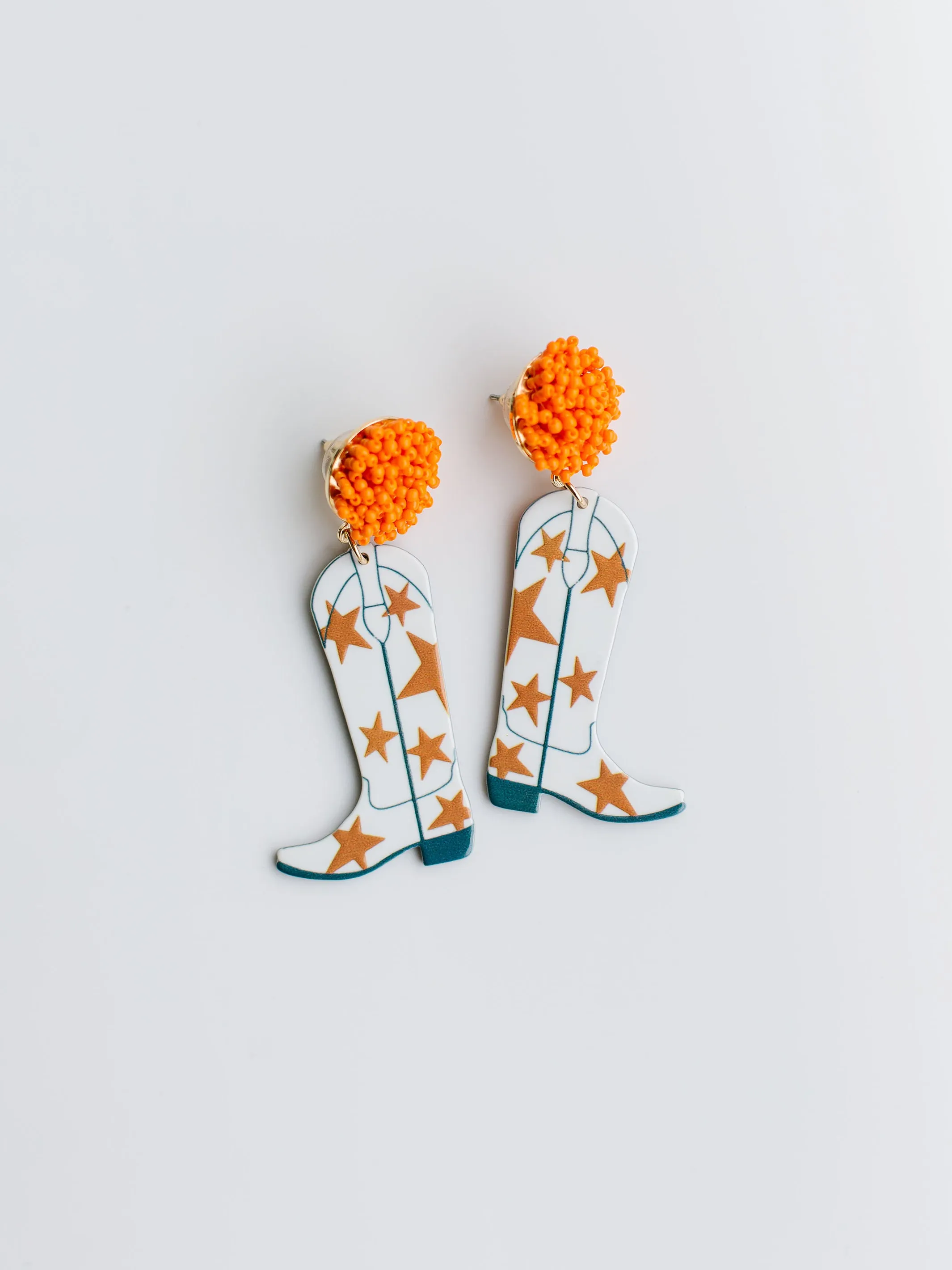 Gameday Cowgirl Earrings | Orange + White sold by Michelle McDowell