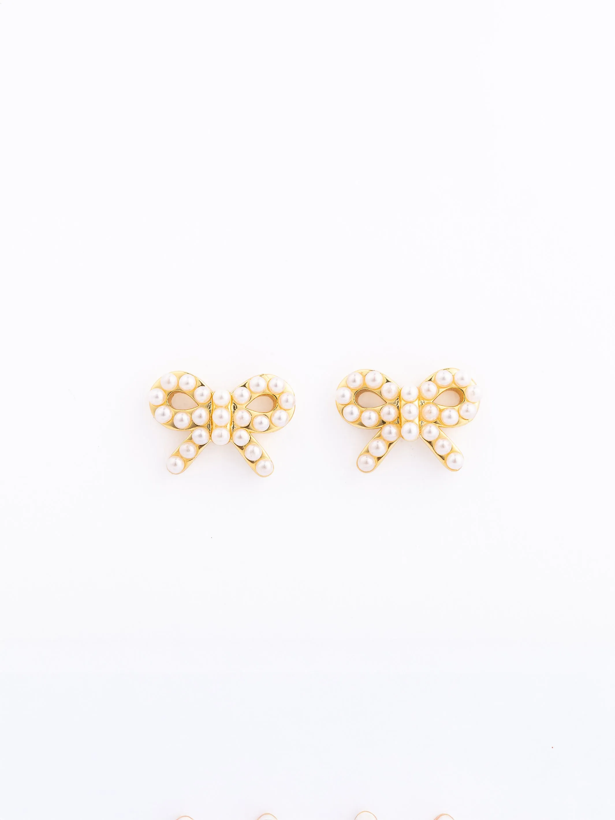 Rowan Pearl Bow Stud Earrings sold by Michelle McDowell