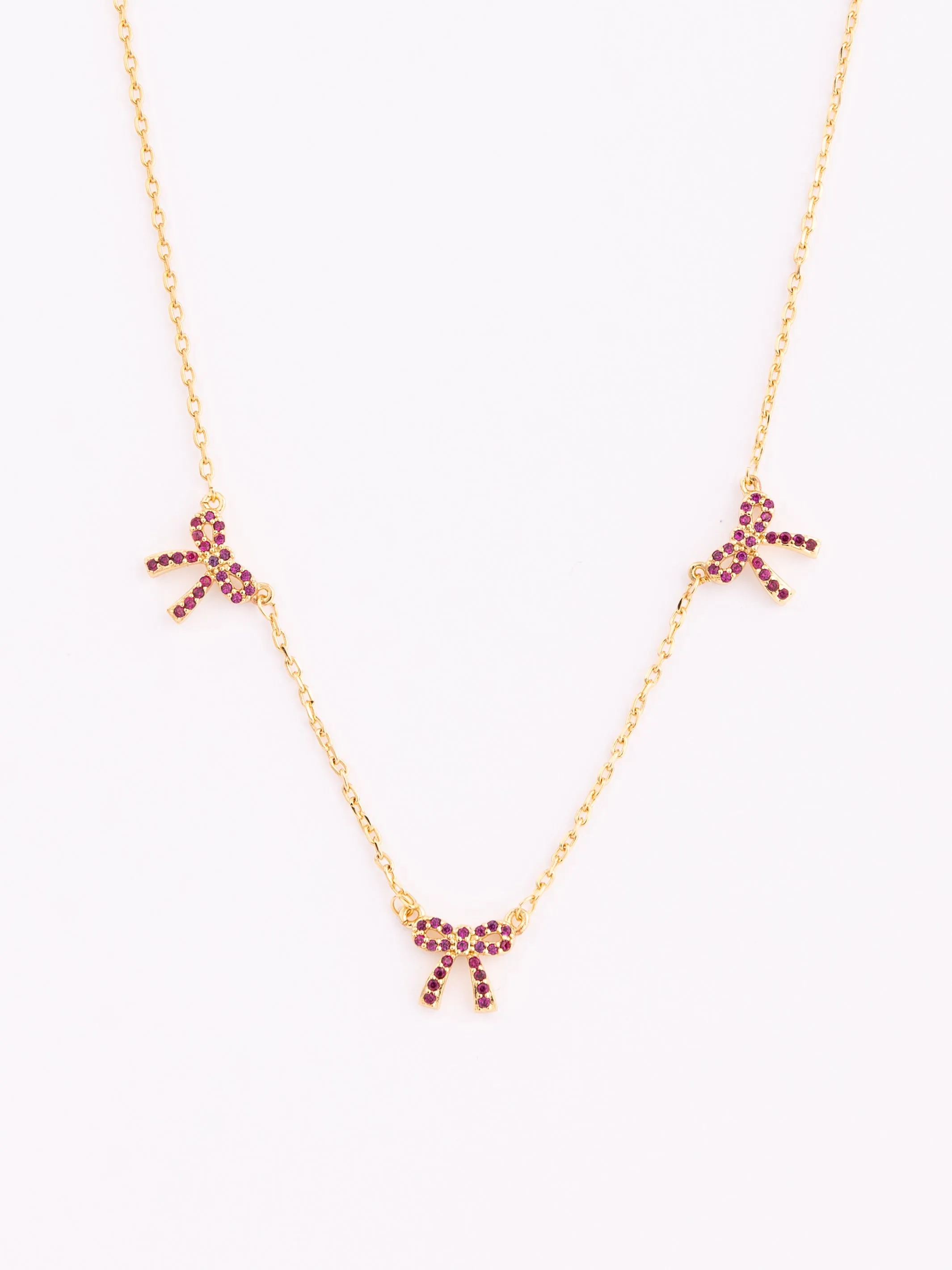 Trio Bow Necklace | Red sold by Michelle McDowell