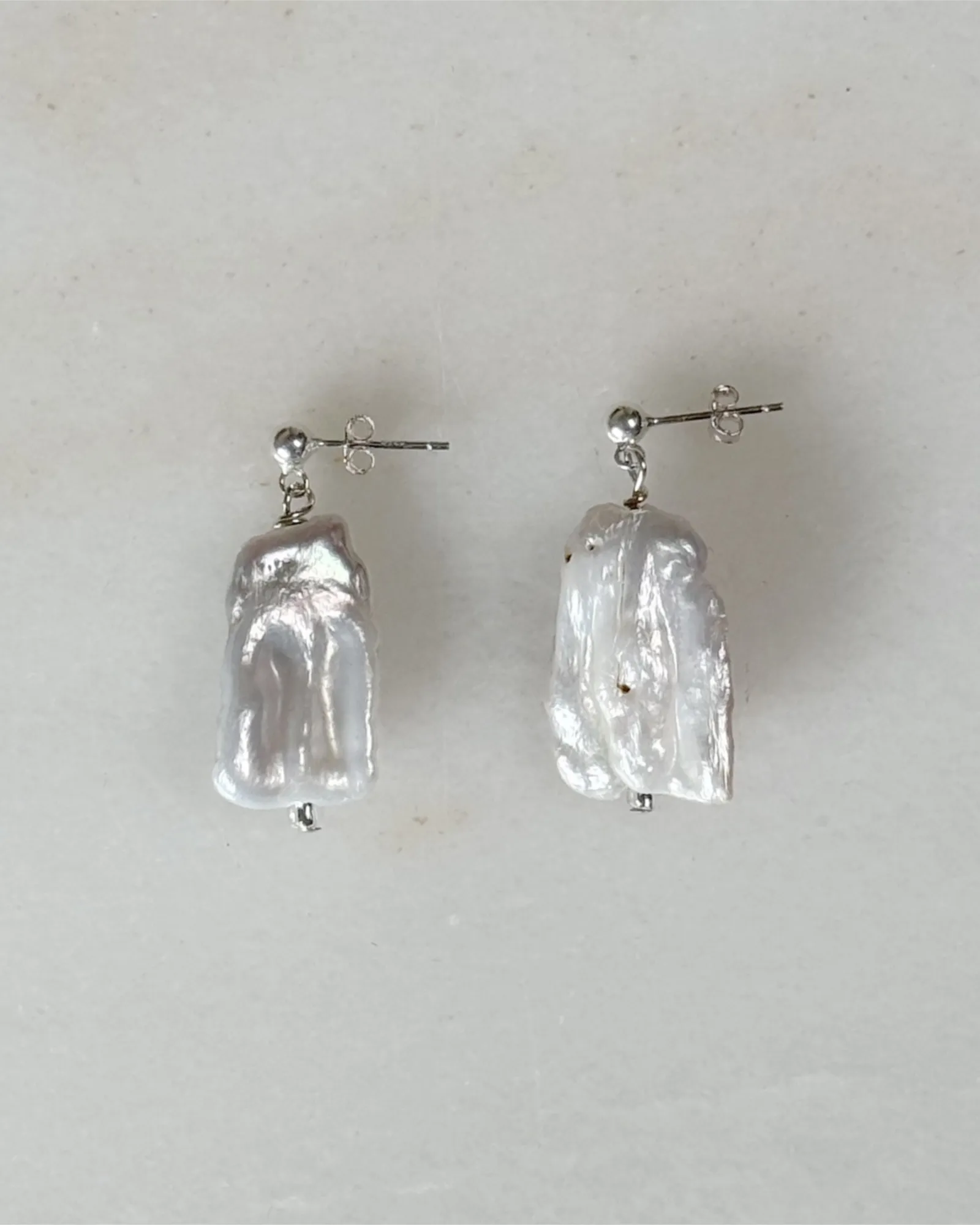 Droplet Pearl Stud Earrings sold by sonderhaus
