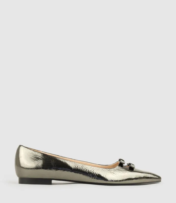 EVAINE Double Bow Flat Pump in Pewter Crinkle Patent sold by Edward Meller