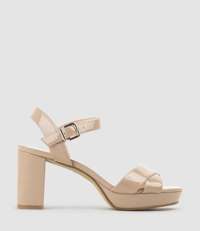 ROWAN80 Asymmetrical Platform Sandal in Nude Patent sold by Edward Meller
