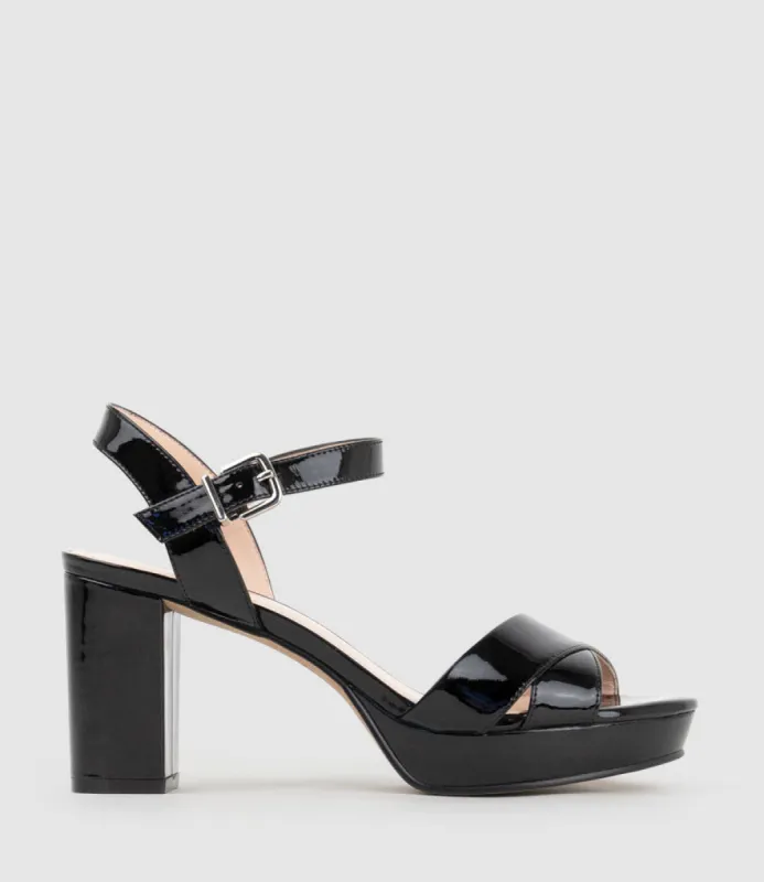 ROWAN80 Asymmetrical Platform Sandal in Black Patent sold by Edward Meller