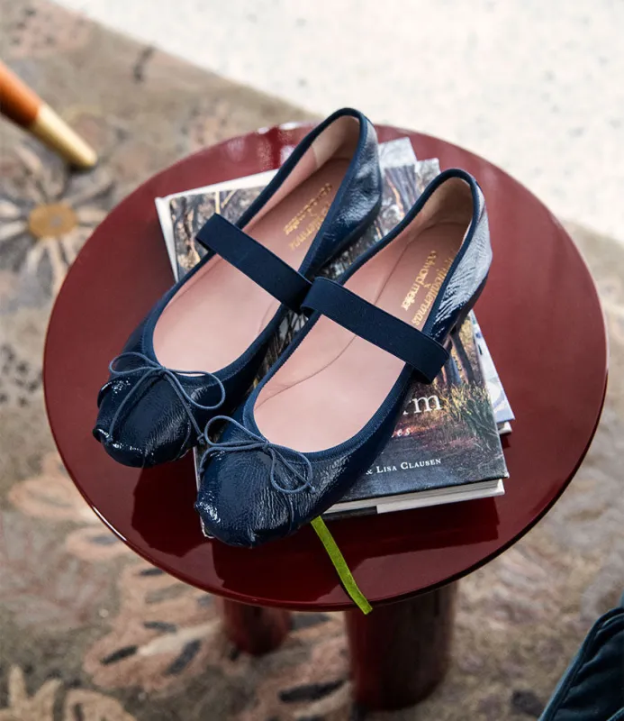 EFFIE Ruched Ballet with Strap in Navy Patent sold by Edward Meller