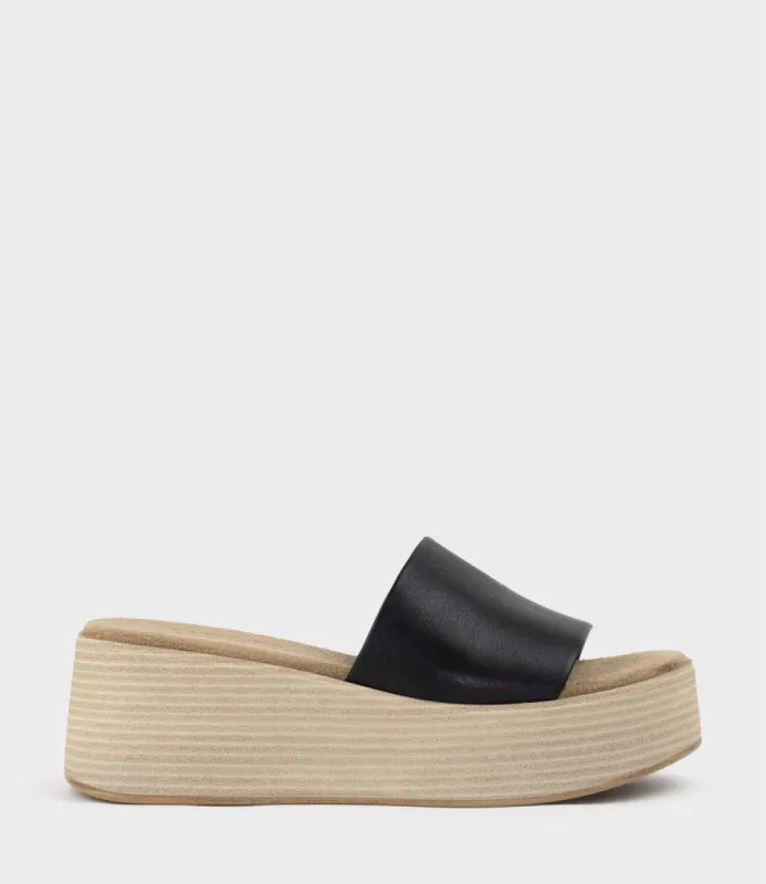 LEVON Slide on Wedge in Black sold by Edward Meller