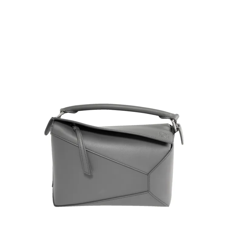 PUZZLE EDGE SMALL BAG sold by Hirshleifers