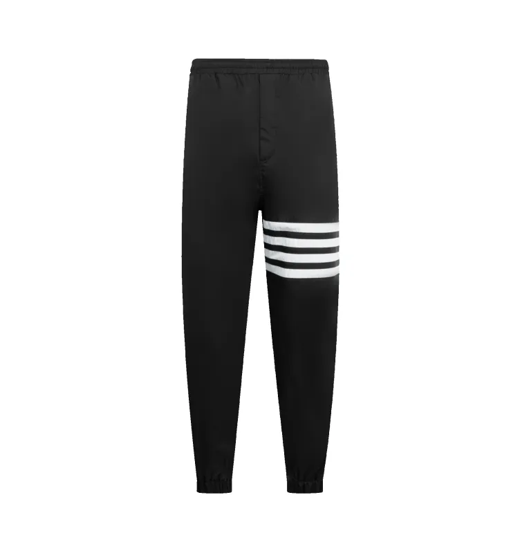 SHINY RIPSTOP 4-BAR TRACK PANTS (MENS) sold by Hirshleifers