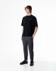 Jogger tiro medio negro jaspe sold by Gef