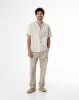 Camisa loose fit manga corta habana con rayas sold by Gef