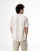 Camisa loose fit manga corta habana con rayas sold by Gef