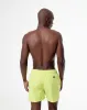 Pantaloneta verde sold by Gef