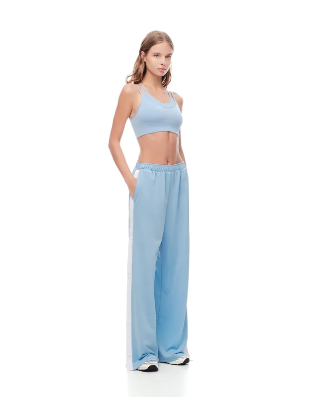 Pantalón broches laterales azul claro para mujer sold by Gef