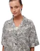 Camisa regular fit manga corta cruda estampada sold by Gef