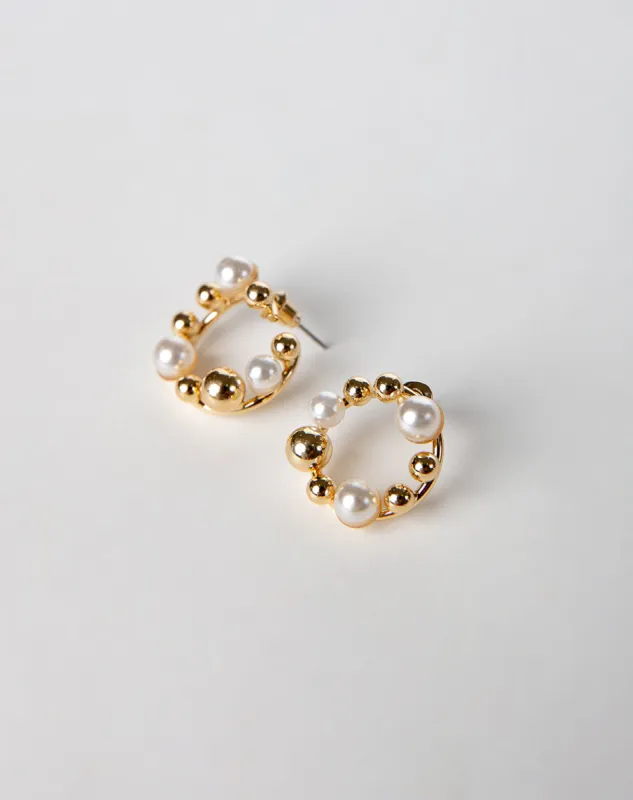 Arete dorado sold by Gef