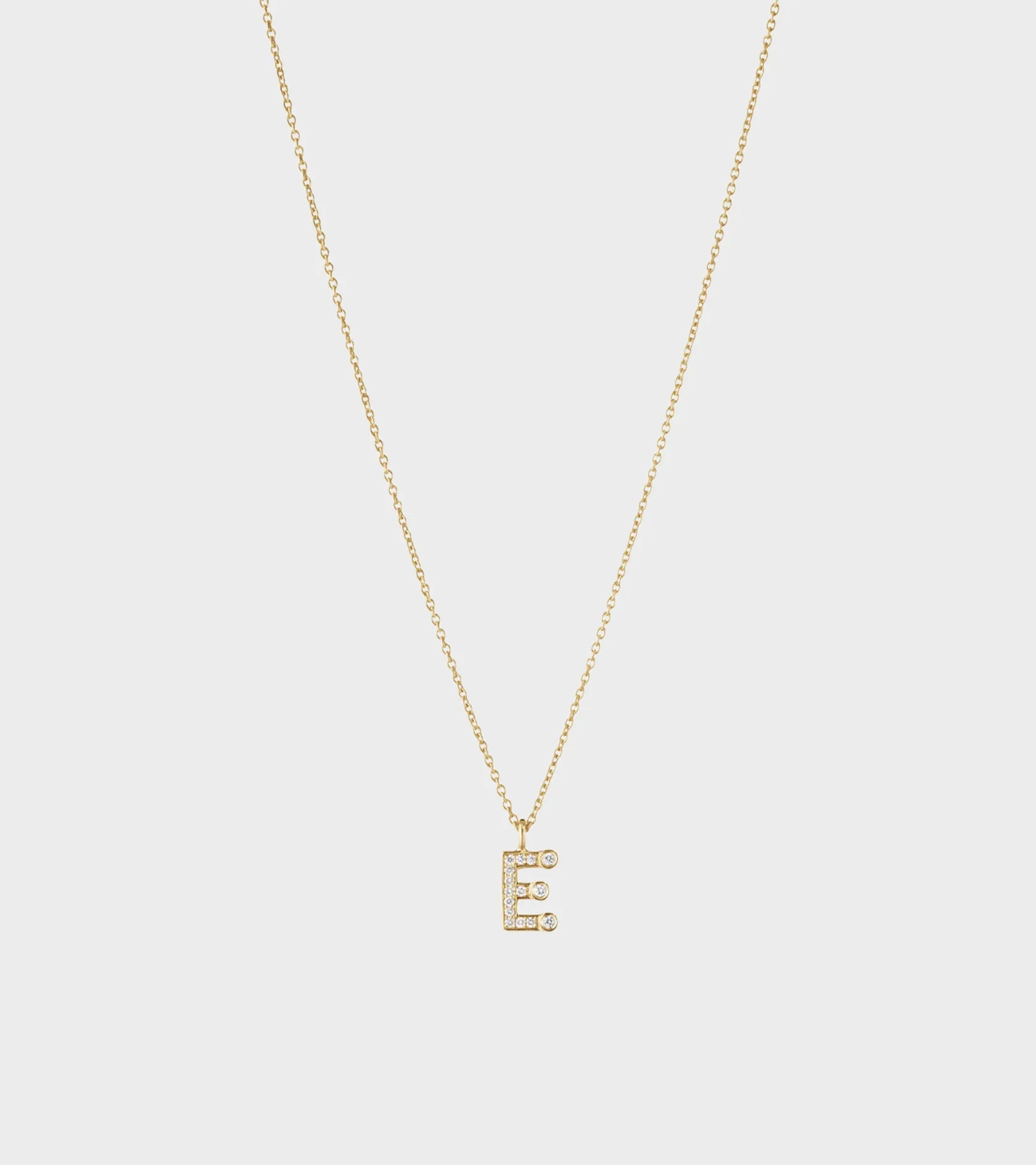 Simple E Necklace Gold sold by Dr. Adams