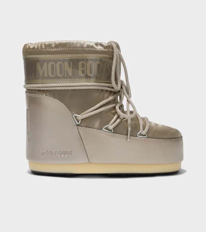 Moon Boot Icon Low Glance Satin Platinum sold by Dr. Adams
