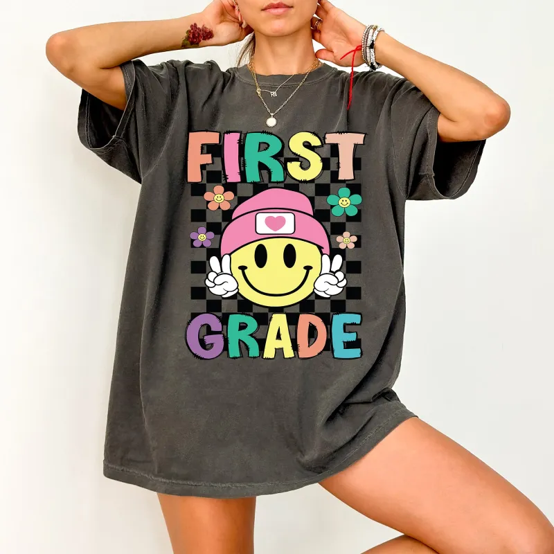 First Grade, Smiley Face, Teacher, Back to School, First Day of School, Cute, Teacher Appreciation, Coquette, Comfort Colors T-Shirt sold by Refinery Number One