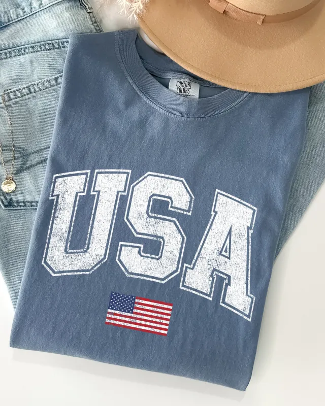 USA, Flag, Collegiate, Varsity, Olympics, Patriotic, Independence Day, Fourth Of July, America Shirt Comfort Colors T-Shirt sold by Refinery Number One