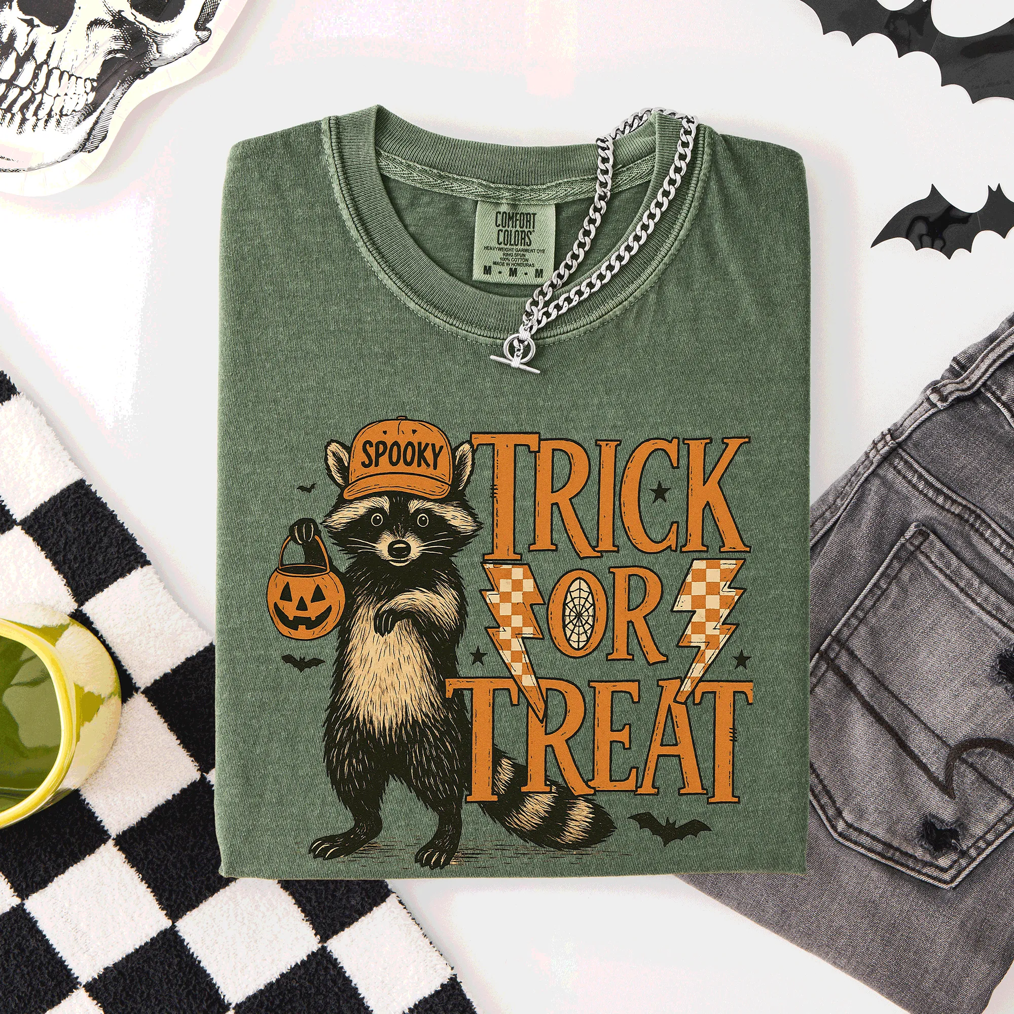 Trick or Treat Raccoon Halloween Mischief With Skeletons Ghosts Cats And Pumpkins Comfort Colors Tee sold by Refinery Number One product image thumbnail 3