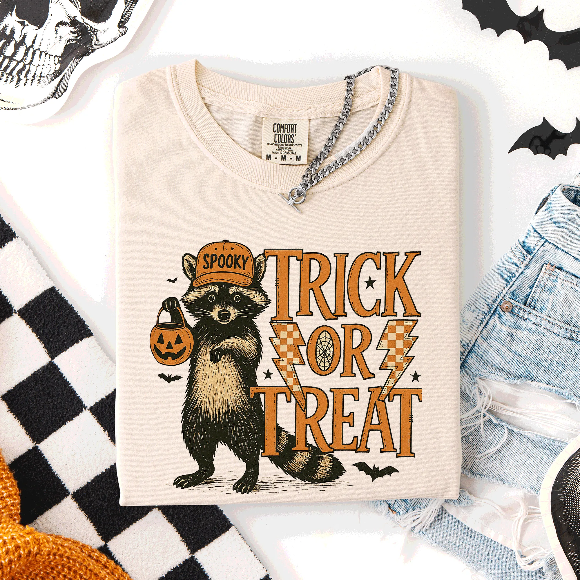 Trick or Treat Raccoon Halloween Mischief With Skeletons Ghosts Cats And Pumpkins Comfort Colors Tee sold by Refinery Number One product image thumbnail 2