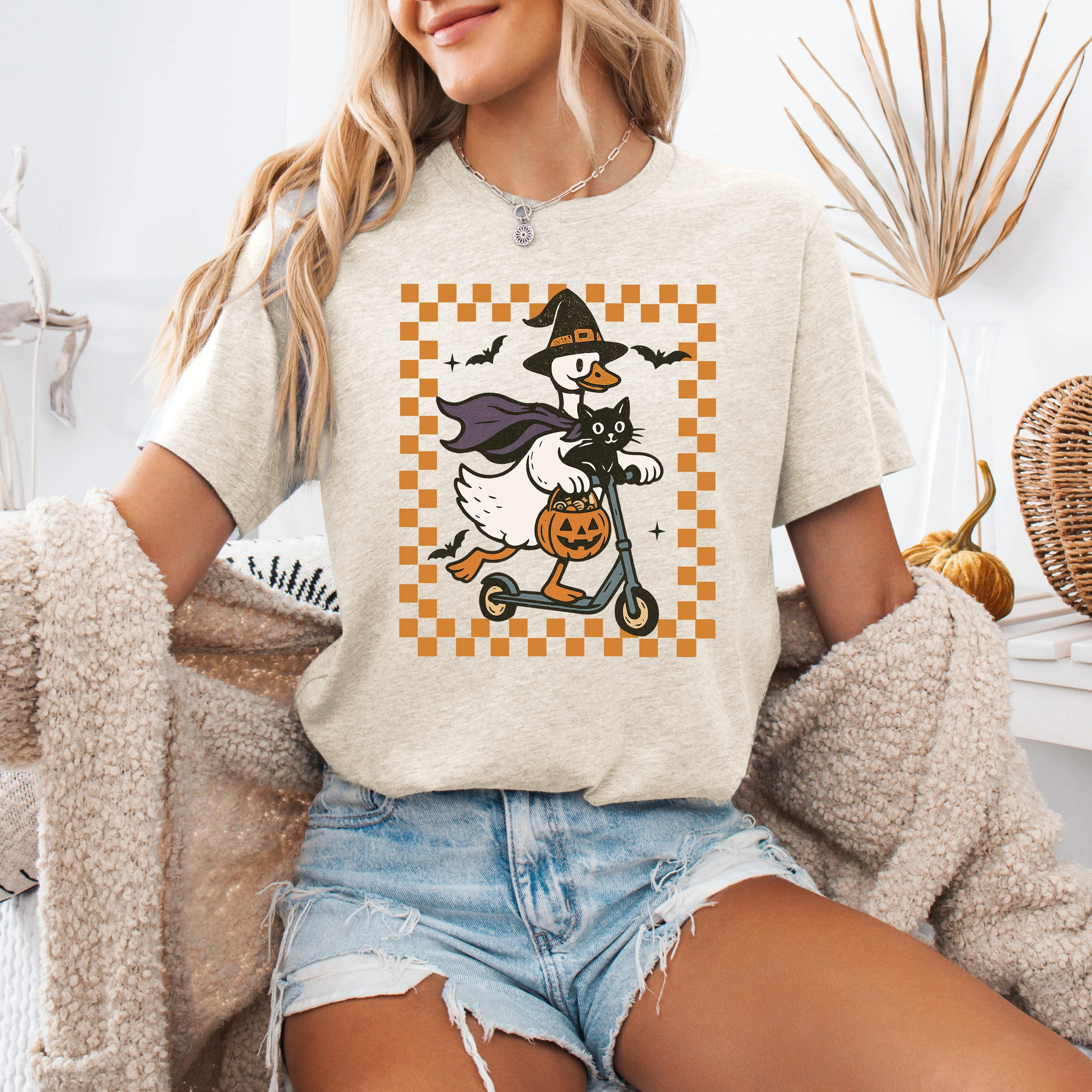 Funny Halloween Goose, Black Cat, Witch, Checkered Cartoon Illustration Graphic Tee sold by Refinery Number One