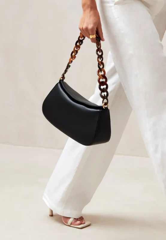 The Curl Black Leather Shoulder Bag sold by Alohas