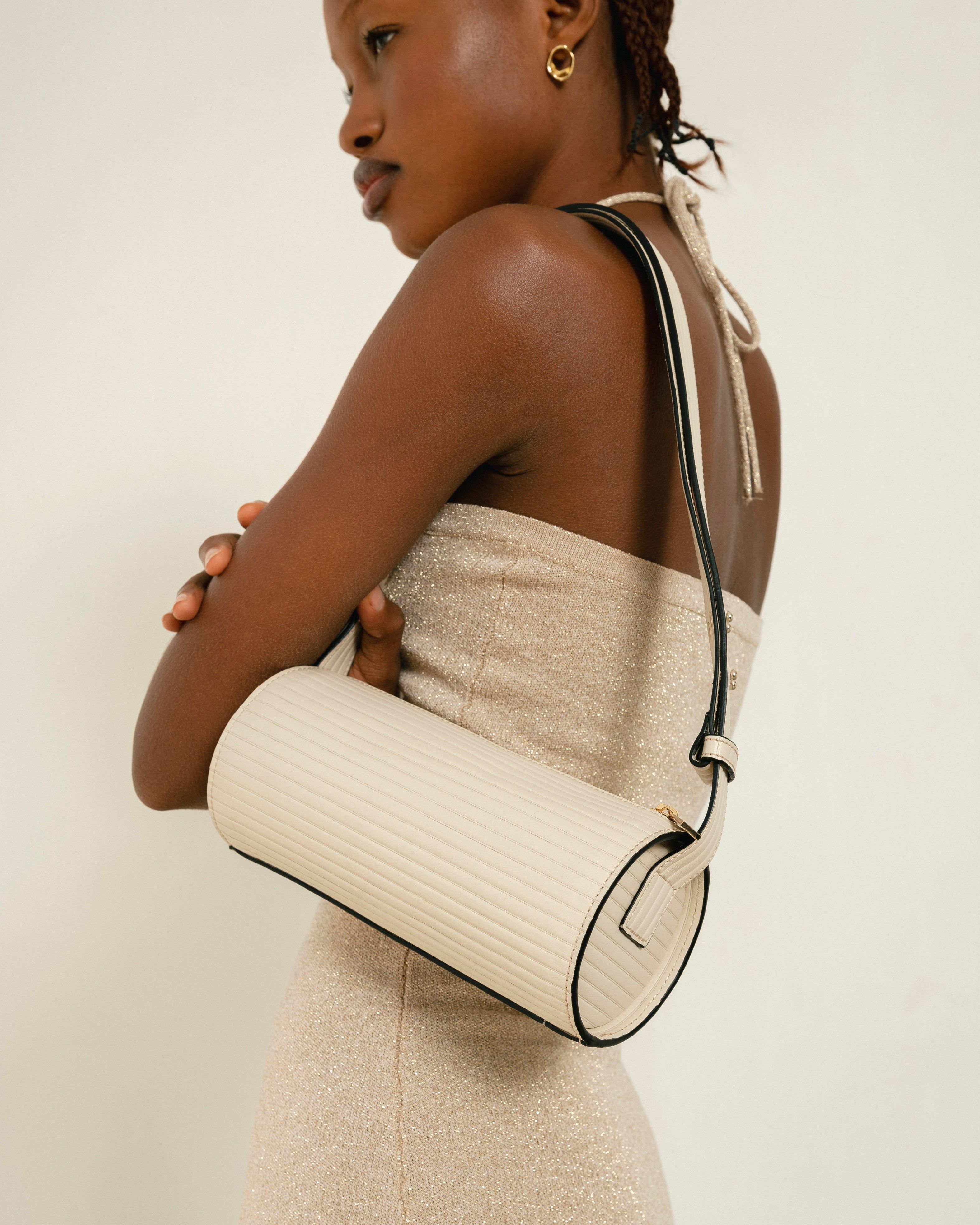 The I Pleated Cream Leather Shoulder Bag sold by Alohas