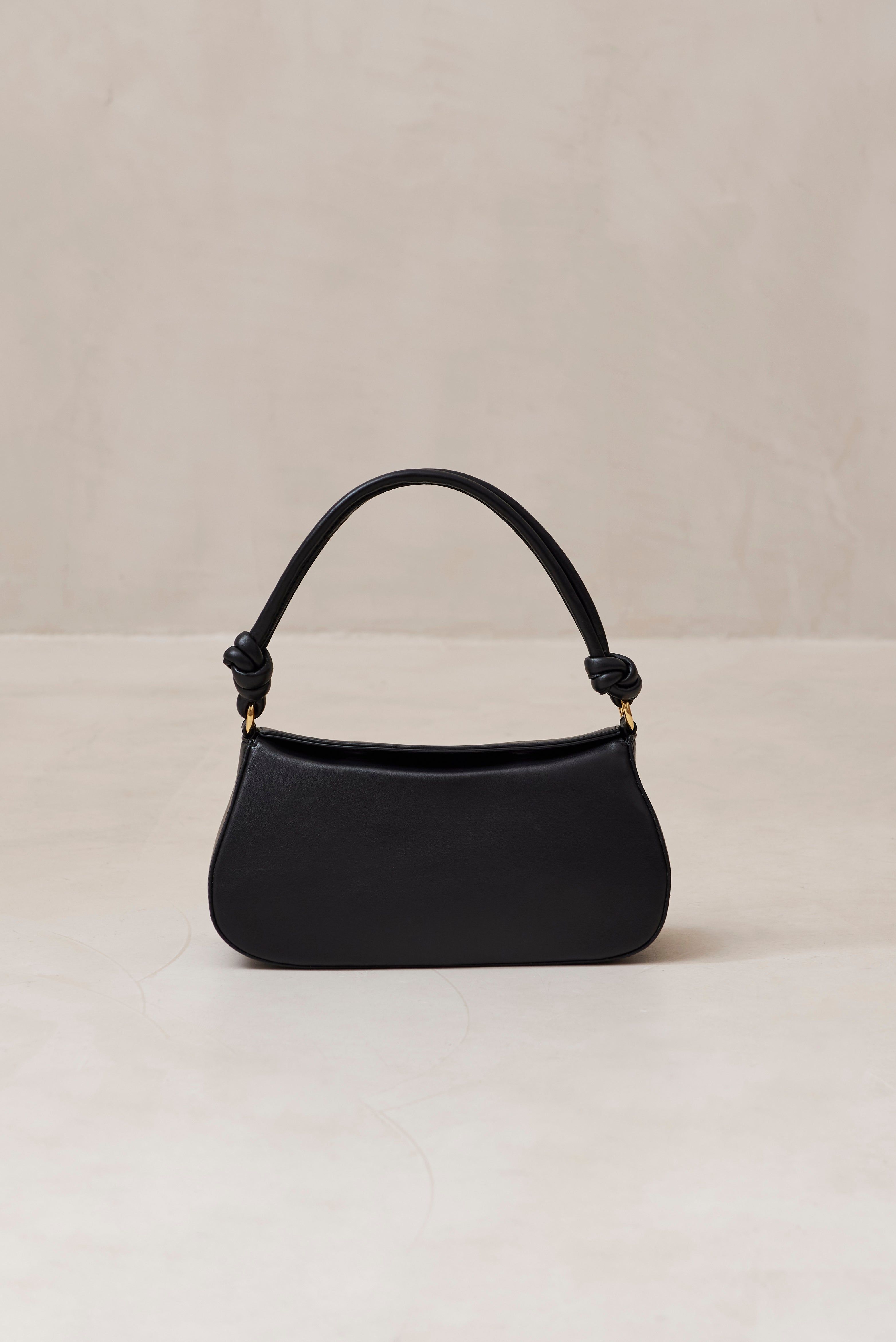 The Curl Knot Black Leather Shoulder Bag sold by Alohas