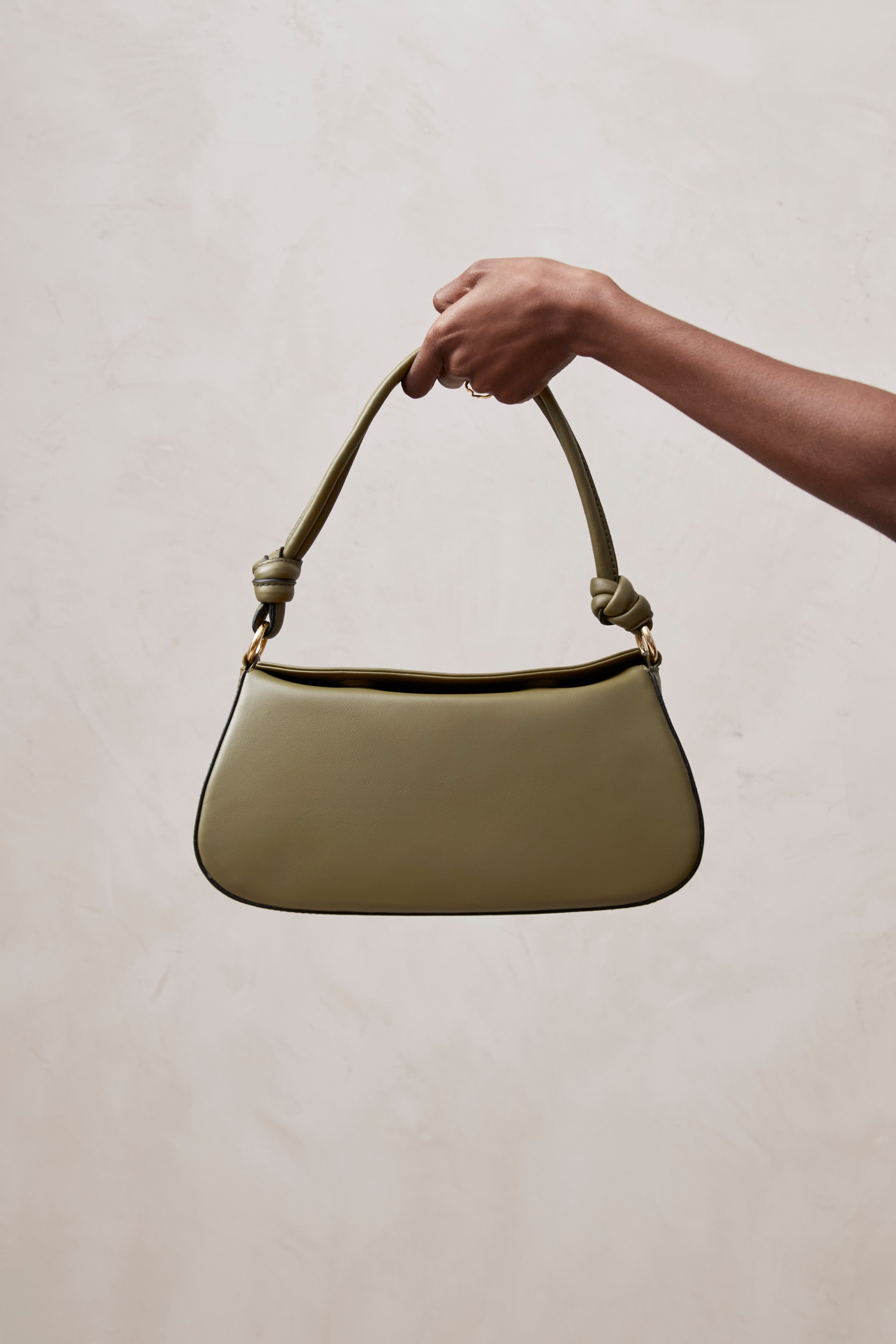 The Curl Knot Green Leather Shoulder Bag sold by Alohas