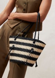 The Tangle Crochet Bicolor Black Cream Shoulder Bag sold by Alohas