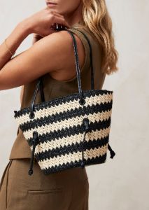 The Tangle Crochet Bicolor Black Cream Shoulder Bag sold by Alohas