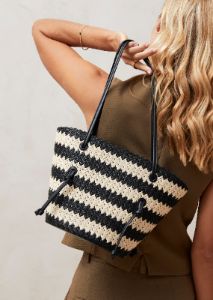 The Tangle Crochet Bicolor Black Cream Shoulder Bag sold by Alohas
