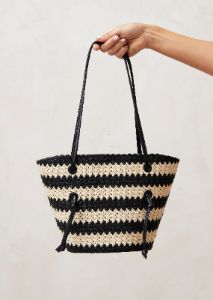 The Tangle Crochet Bicolor Black Cream Shoulder Bag sold by Alohas