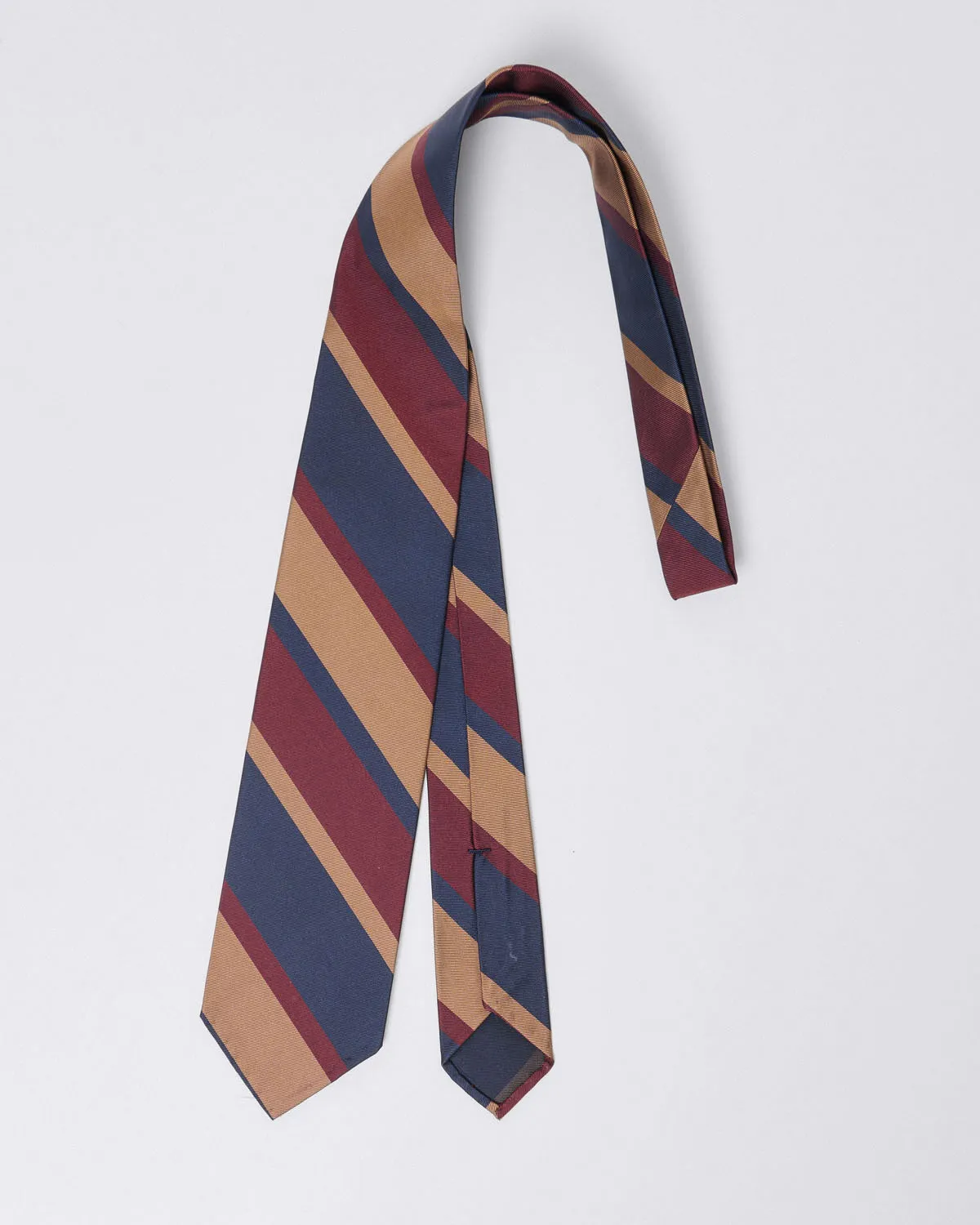 Unlined silk regimental tie in shades of blue, burgundy, and sand sold by Finamore