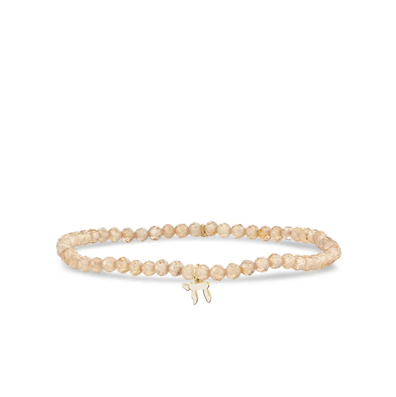 Gold & Enamel Tiny Chai on Beige Zircon made by Sydney Evan