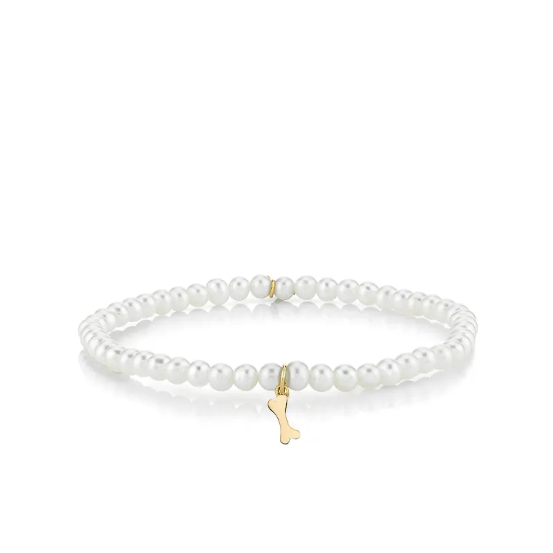 Pure Gold Tiny Dog Bone on Pearls made by Sydney Evan