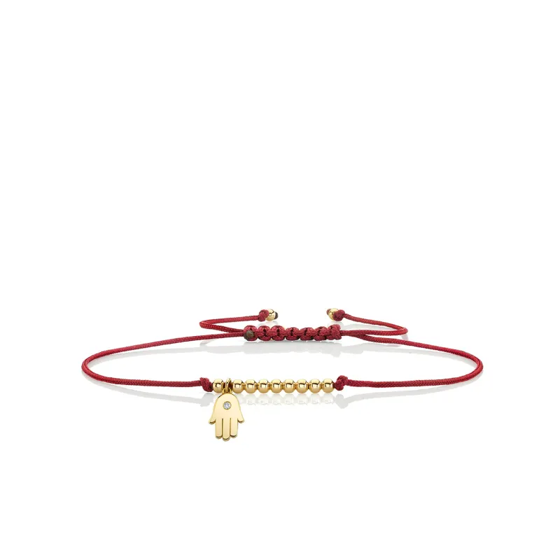 Gold & Diamond Tiny Hamsa Cord Bracelet made by Sydney Evan