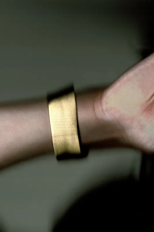 Something of Vast Importance is Being Communicated Just Out of Earshot - Gold Plated Cuff made by Completed Works