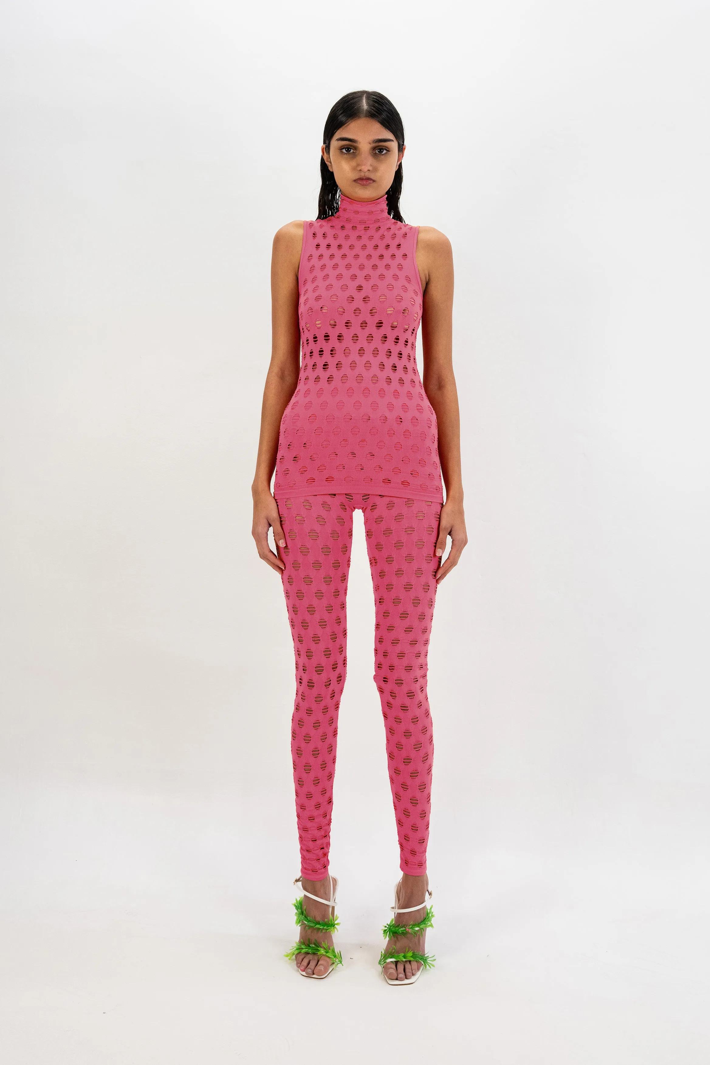 PERFORATED SLEEVELESS TURTLENECK sold by Maisie Wilen