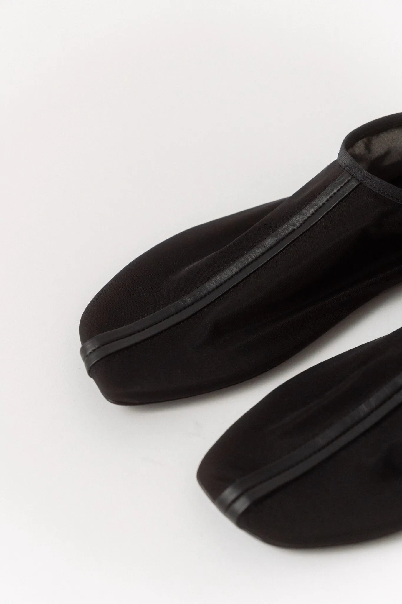 Black Leather Trimmed Mesh Flat sold by Bessette