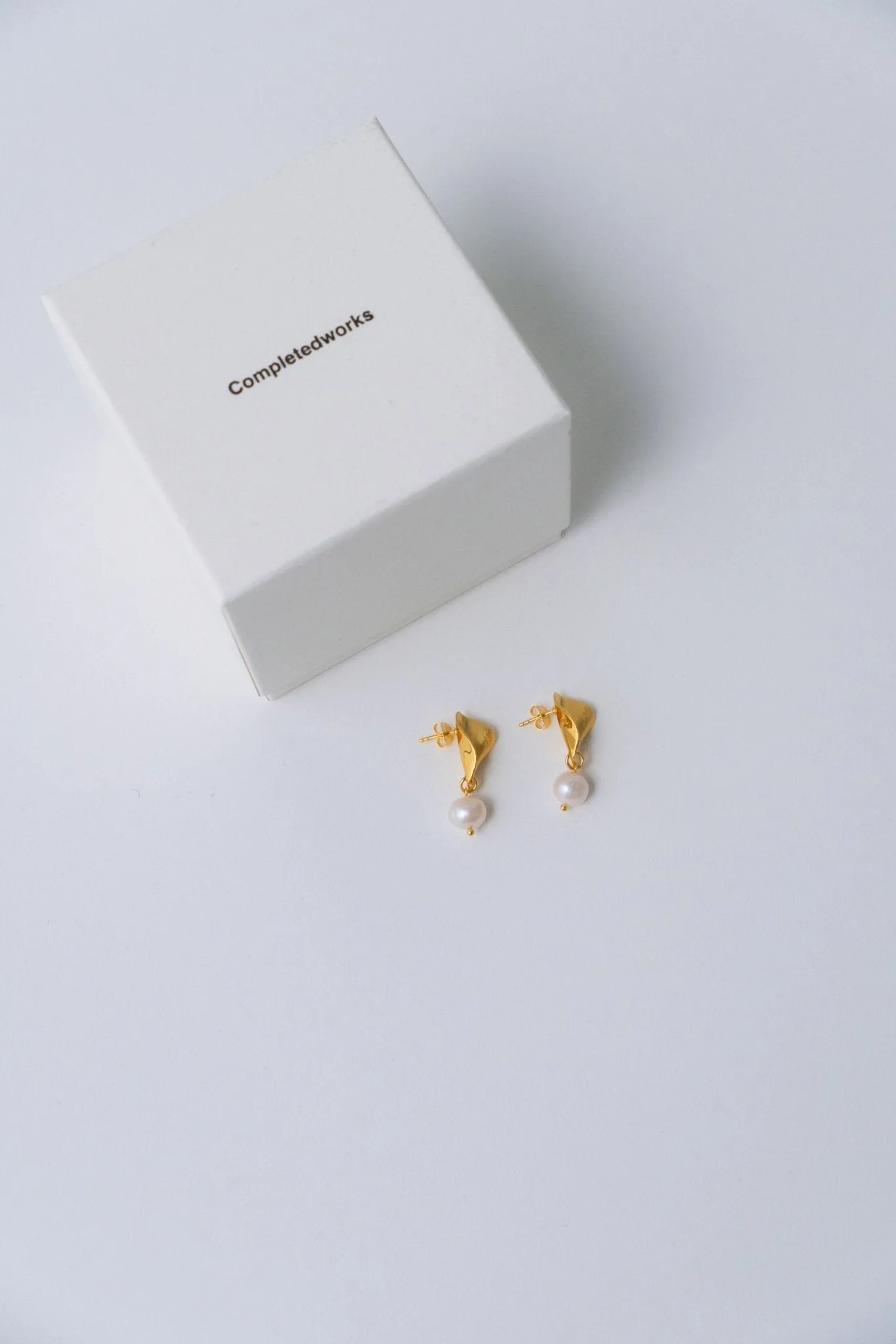 Completedworks Folded Gold Earrings with Pearl sold by Bessette