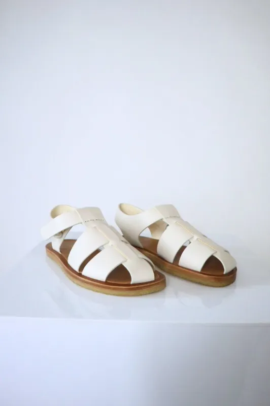 The Row Fisherman Sandal Milk (38 EU) sold by Bessette