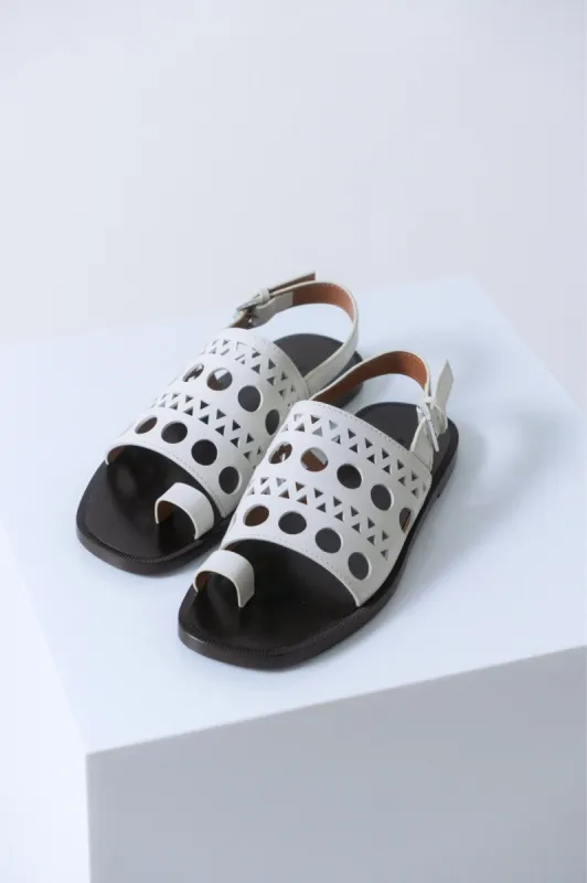 Alaïa Laser Cut White Slingback Sandals sold by Bessette