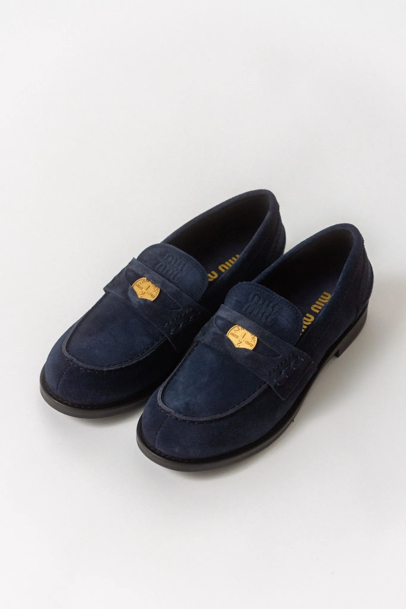 Miu Miu Logo Navy Suede Loafers (38 EU) sold by Bessette